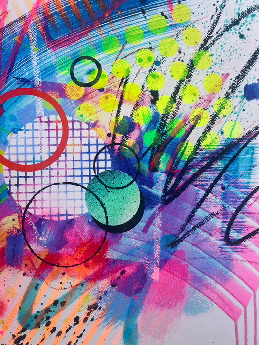 Close-up of details and textures of a dynamic abstract artwork by Kate Elkington featuring bold splashes of neon pink, jade green, yellow, orange, and blue, combined with graphic circle shapes, stripes, black accents and white grid patterns. Expressive brush strokes, crayon scribbles and paint drips add movement and energy, creating a vibrant and playful composition that radiates joy and positivity.
