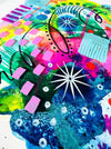 Close-up of details and textures of a vibrant abstract giclée art print by Kate Elkington, featuring a playful mix of shapes and colours. Greens, yellows, blues, indigo and pinks are blended with soft washes of watercolour, overlaid with whimsical patterns like dots, stars, and swirls. Free-flowing lines and dynamic brushstrokes create a sense of movement, while geometric elements such as squares and circles add structure.
