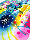 Close-up of details and textures of a vibrant abstract giclée art print by Kate Elkington, featuring a playful mix of shapes and colours. Golden yellows, blues, indigo and pinks are blended with soft washes of watercolour, overlaid with whimsical patterns like dots, stars, and swirls. Free-flowing lines and dynamic brushstrokes create a sense of movement, while geometric elements such as squares and circles add structure.
