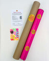 A carefully packaged up fine art giclée print by Kate Elkington. The print is wrapped in hot pink acid free tissue paper, carefully rolled and secured with attractive yellow and pink logo stickers. Next to it is the cardboard postal tube. Next to that is a certificate of authenticity for the limited edition print and a small, original, mixed media, mini postcard artwork as a thank you gift.